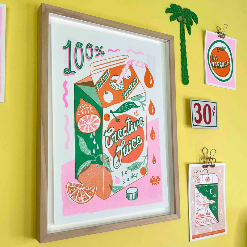 a green, pink and orange orange juice carton with the typography 100% Freshly Squeezed Creative Juice - 1 of your 5 a day by British illustrator Jacqueline Colley