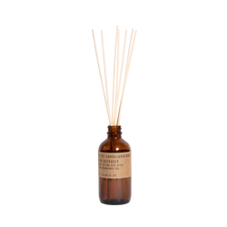 reed diffuser in amber glass number 32 by pf candle co, available at www.cuemars.com