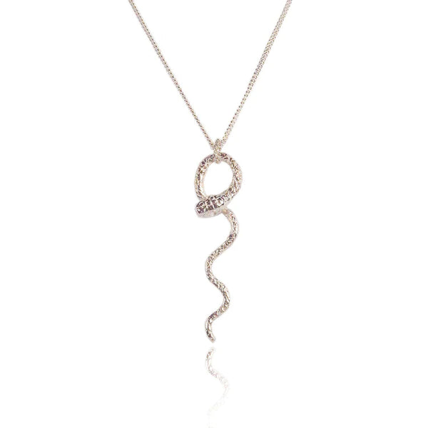 silver snake necklace with intricate skin details made by hand in London by Momocreatura. Avialable at www.cuemars.com