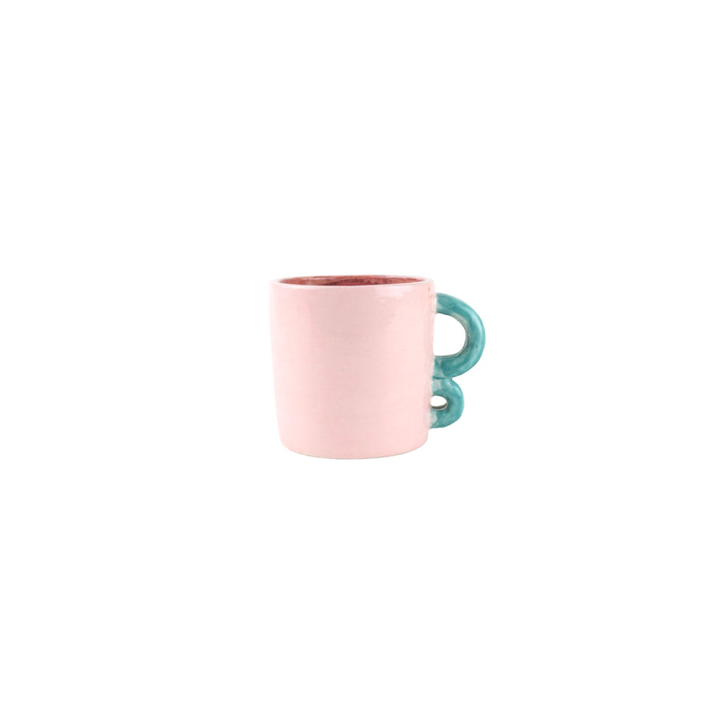 Pastel Pink glazed mug with blue handles handmade by Arianna de Luca, available at www.cuemars.com
