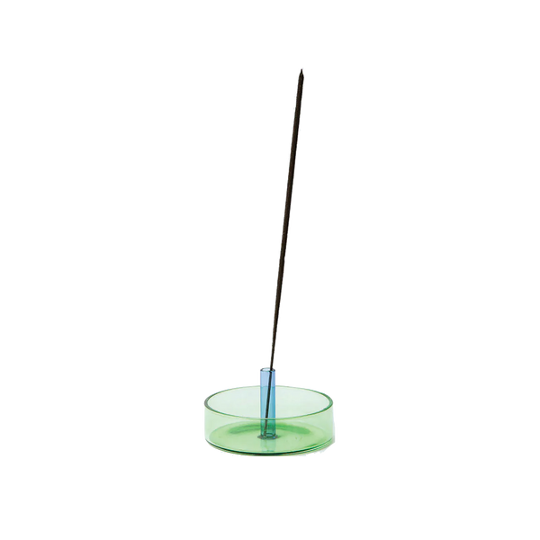 Green and blue glass incense holder with an incense stick on it by British brand Block Design, available at www.cuemars.com
