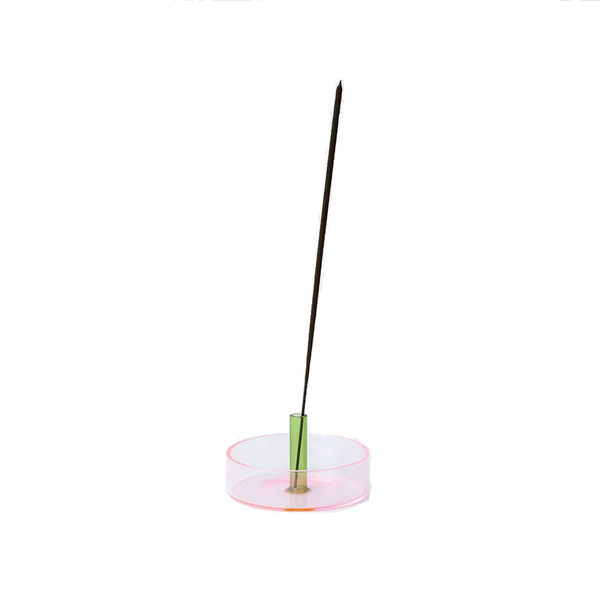 Pink and green glass incense holder with an incense stick on it by British brand Block Design, available at www.cuemars.com