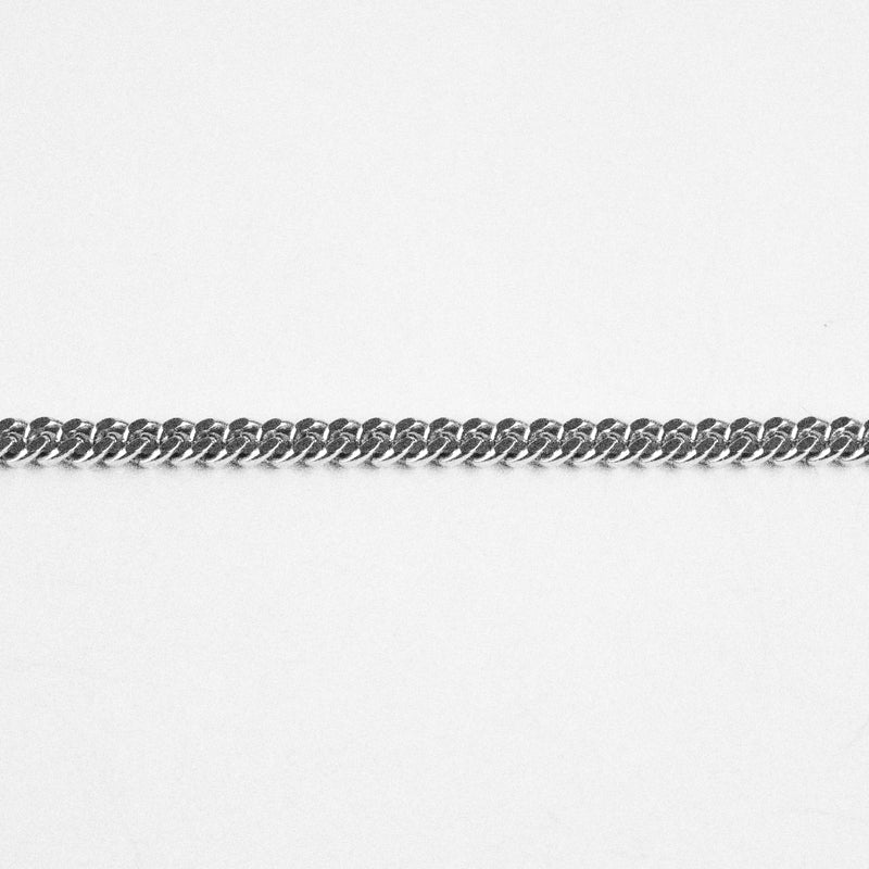 Slim chain necklace handmade and hallmarked in London. Available at www.cuemars.com