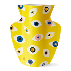 Colourful paper vase filled with Nazar eyes in yellow, blue, pink and gold. Designed by Spanish brand Octaevo, available at www.cuemars.com
