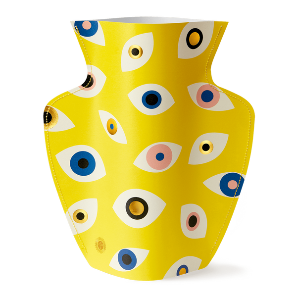Colourful paper vase filled with Nazar eyes in yellow, blue, pink and gold. Designed by Spanish brand Octaevo, available at www.cuemars.com