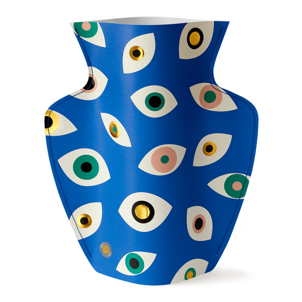 Colourful paper vase filled with Nazar eyes in blue, pink, green and gold. Designed by Spanish brand Octaevo, available at www.cuemars.com