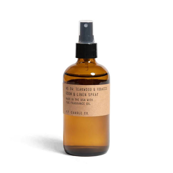 N04 Teakwood and Tobacco Linen Spray in amber glass bottle, by Californian PF Candle Co. Available at cuemars.com