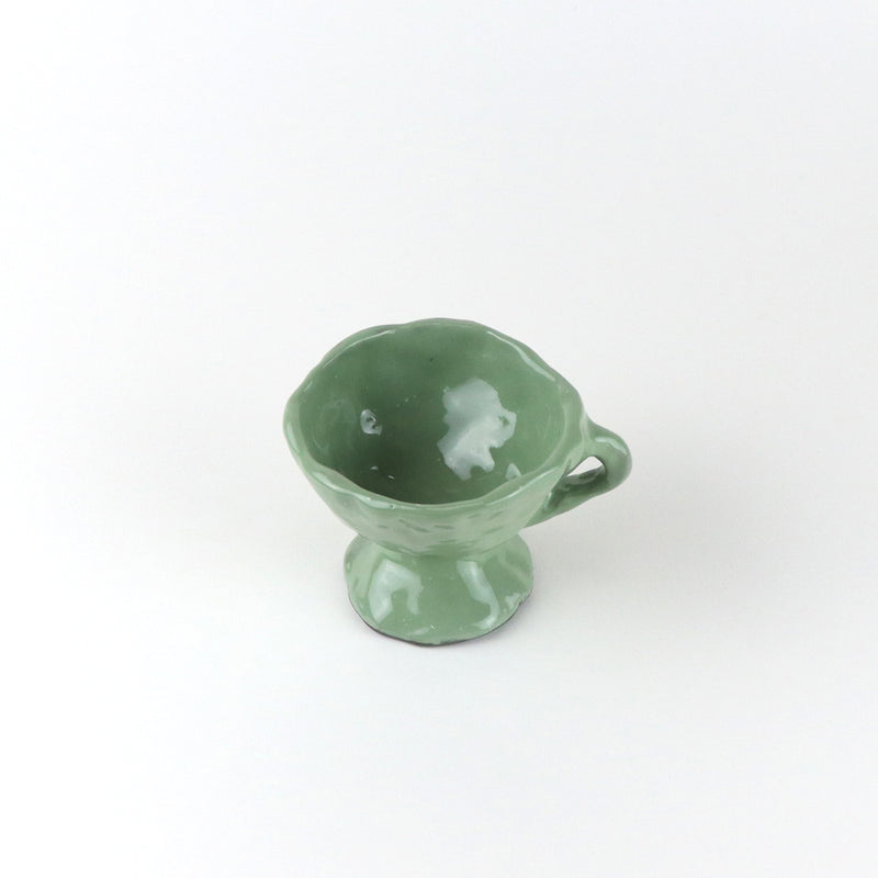 Green handmade espresso mug by Warsaw based ceramic studio Siup. Available at Cuemars