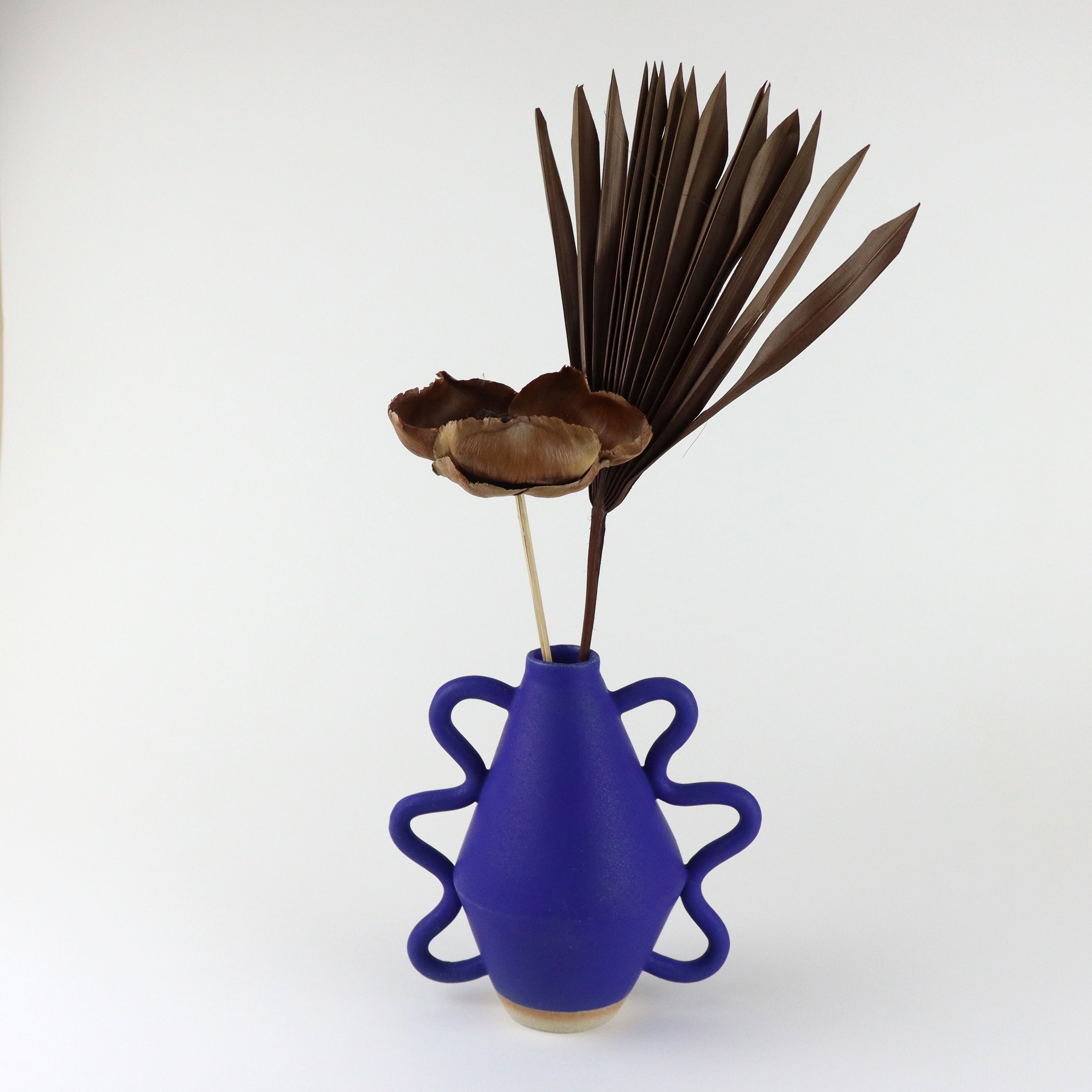 Blue Vase with wiggle arms hand thrown by Bristolian Sophie Alda. Available at www.cuemars.com