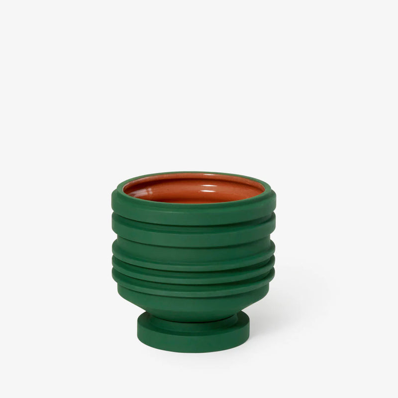 Sculptural deep green ceramic planter designed by Simone Brewster, available at www.cuemars.com