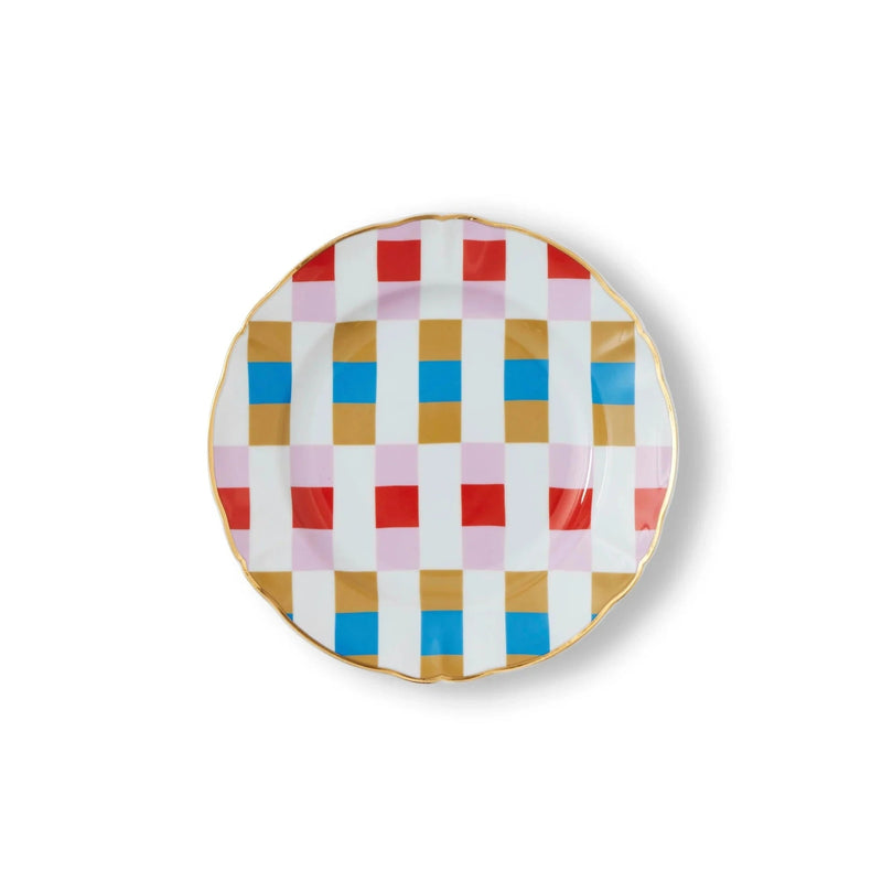 Round porcelain dessert plate from Bitossi Home's Abracadabra collection, featuring a vivid geometric design with multicolored starburst and pinwheel motifs, accented with gold detailing for a magical, eye-catching finish
