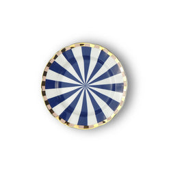 A round porcelain dessert plate from the Bitossi Home Abracadabra collection, featuring a hypnotic blue and white spiral design with a gold-plated rim, blending optical illusion patterns with elegant, whimsical flair.