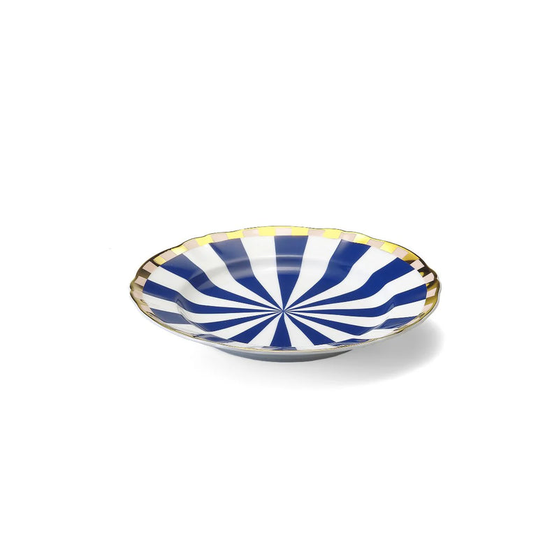 Bitossi Home Abracadabra collection, featuring a hypnotic blue and white spiral design with a gold-plated rim, blending optical illusion patterns with elegant, whimsical flair.