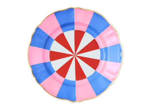 Porcelain dinner plate from Bitossi Home’s Abracadabra collection, showcasing a bold, colourful geometric pattern with a refined gold detailing around the rim.