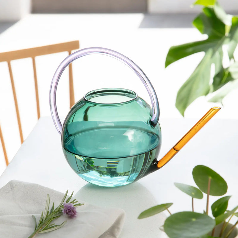 Colourful glass watering can by British homeware brand Block Design, available at www.cuemars.com