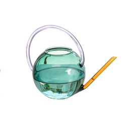 Colourful glass watering can by British homeware brand Block Design, available at www.cuemars.com