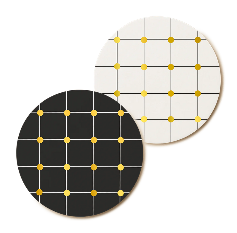 two black and white coasters inspired by the reflection of the sunlight on water designed by Spanish designer brand Octaevo and available at www.cuemars.com