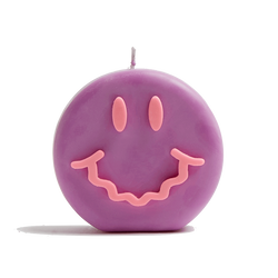 Purple and pink smiley soy wax candle with a wavy smile, by UK based independent brand Wavey Casa, available at www.cuemars.com