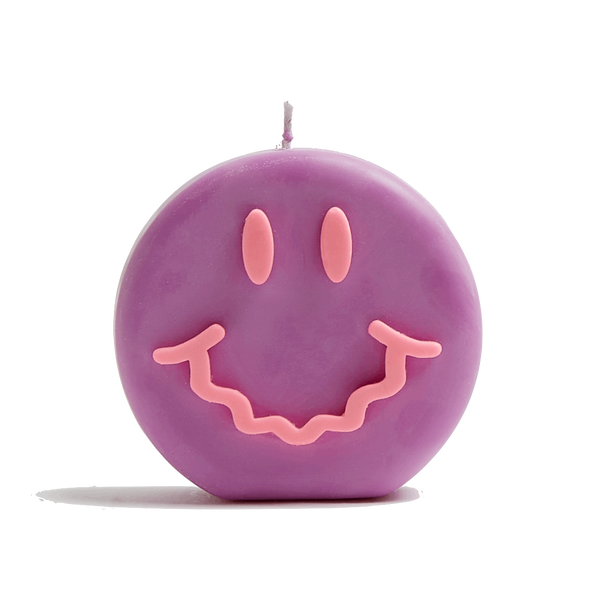 Purple and pink smiley soy wax candle with a wavy smile, by UK based independent brand Wavey Casa, available at www.cuemars.com
