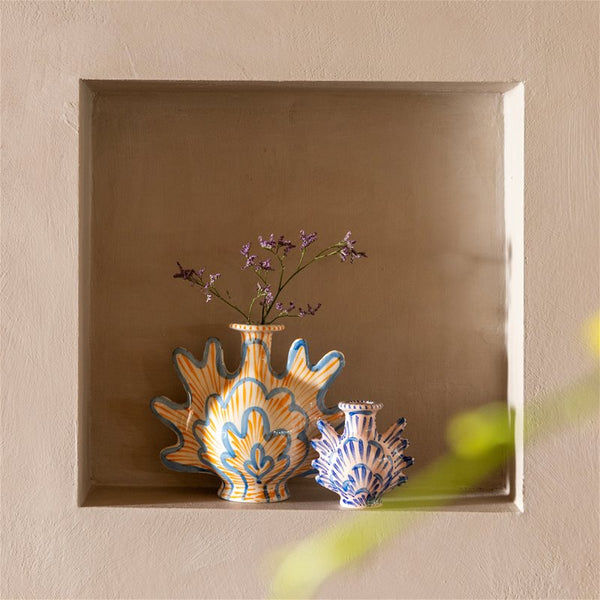 Ceramic blue and orange candle holder in the shape of a shell, by Klevering. Available at www.cuemars.com