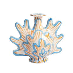 Ceramic blue and orange candle holder in the shape of a shell, by Klevering. Available at www.cuemars.com