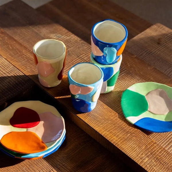 Porcelain small plates in pink, blue, orange, yellow and red by Klevering, available at www.cuemars.com