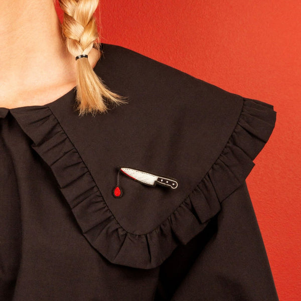 Knife with a drop of blood brooch designed in France by Macon and Lesquoy, ethically made in Pakistan by hand. Available at www.cuemars.com