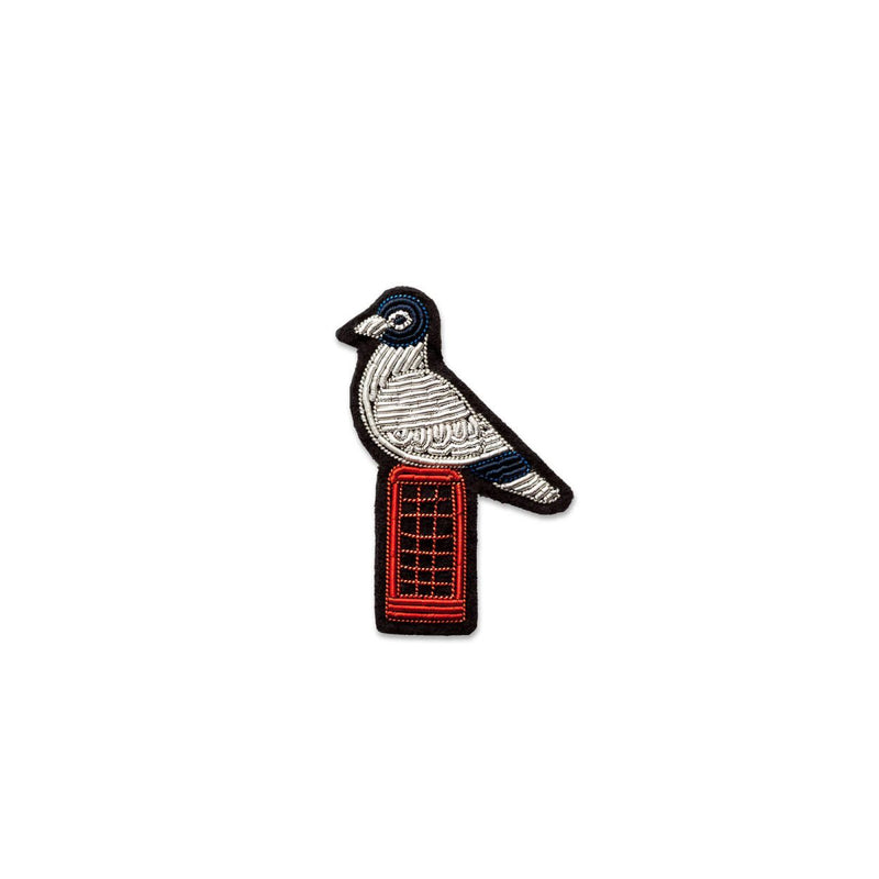 A pigeon on top of a red London phone brooch designed by Macon and Lesquoy in France, ethically hand made in Pakistan. Available at www.cuemars.com