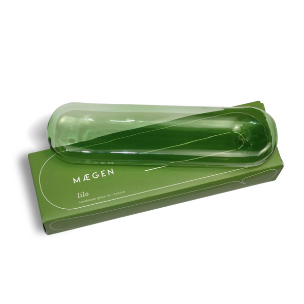 Green handmade glass incense holder by British brand Maegen, inspired by an inflatable lily, available at www.cuemars.com