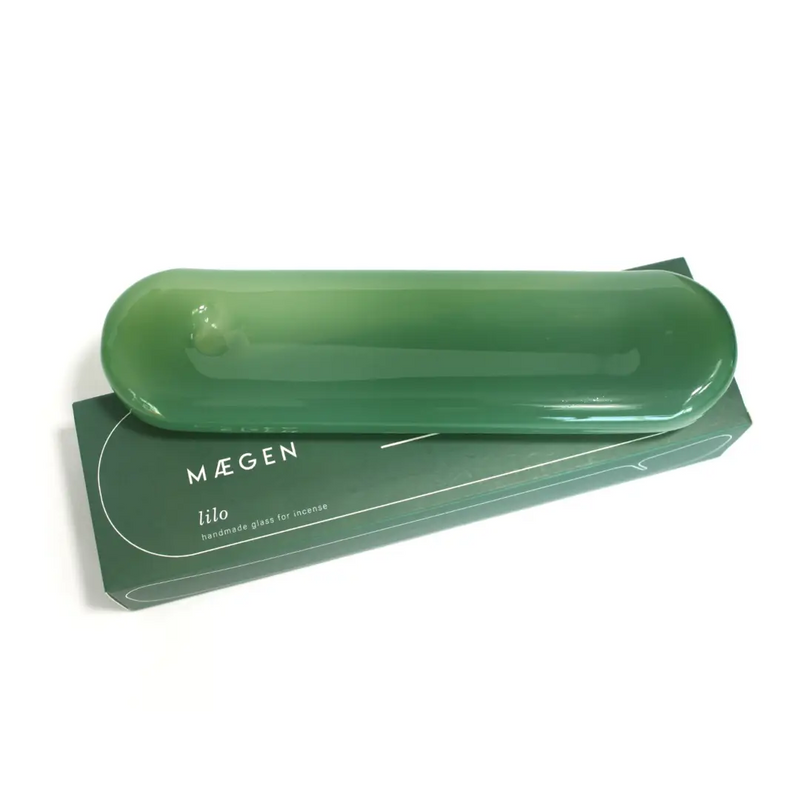Sea green handmade glass incense holder by British brand Maegen, inspired by an inflatable lily, available at www.cuemars.com