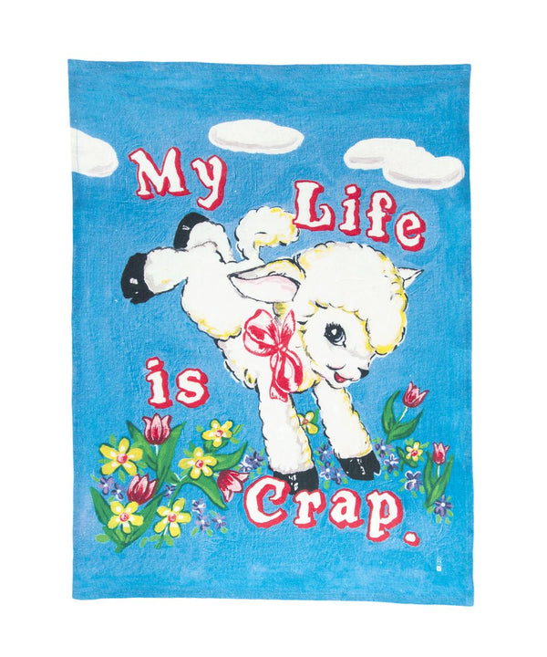 Colourful linen towel featuring a cute old school ship illustration jumping around flowers and the typography My Life is Crap, available at www.cuemars.com