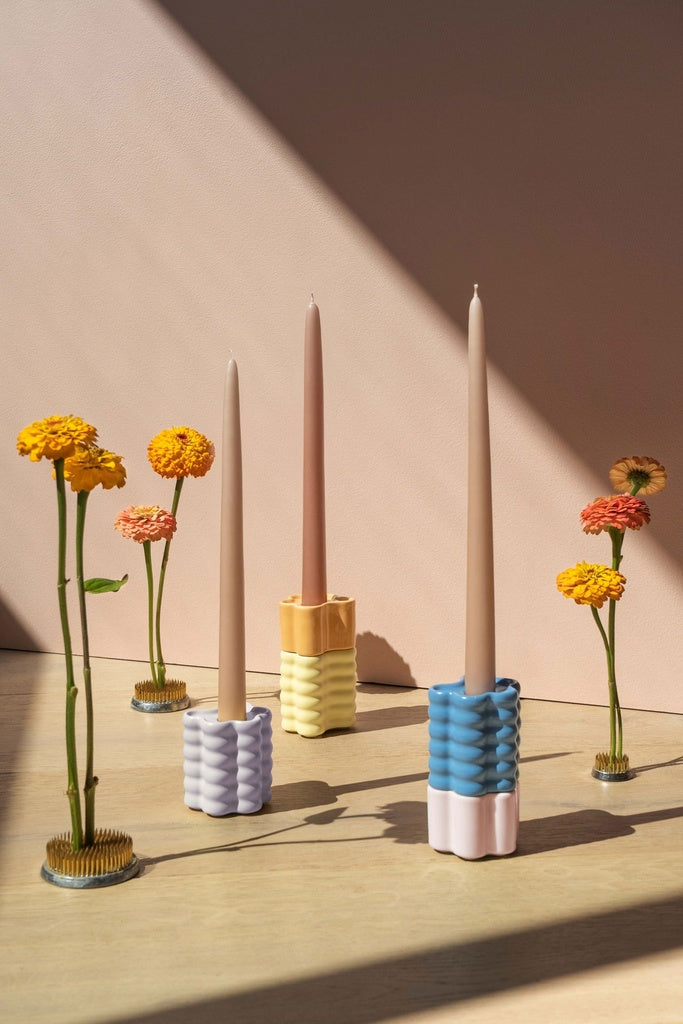 Blue candle holder designed by Spanish brand Octaevo, inspired by flower petals and stackable. Available at www.cuemars.com
