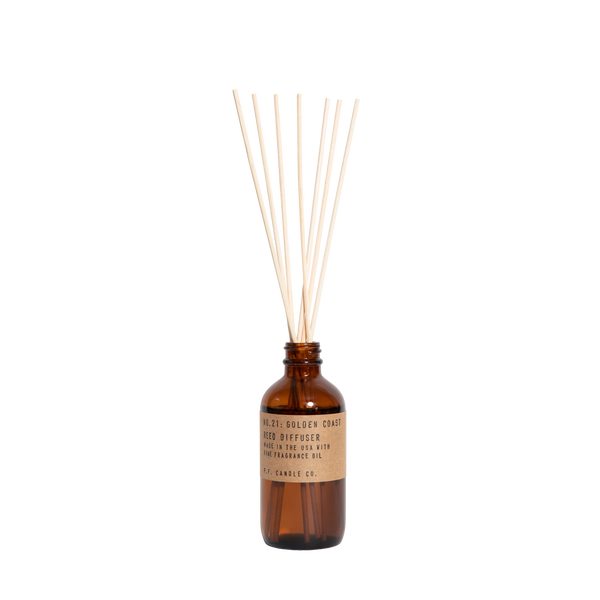 reed diffuser in amber glass number 21 by pf candle co, available at www.cuemars.com