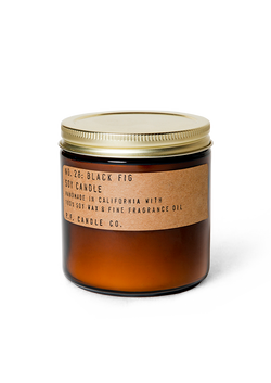 soy wax scented candle in an amber glass jar and metallic lid with a kraft sticker that states Black Fig Soy Candle by PF Candle Co.