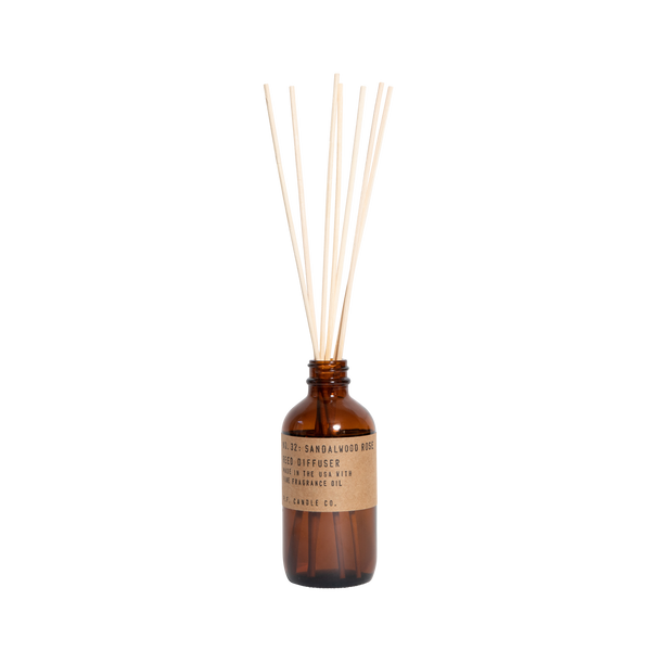 reed diffuser in amber glass number 32 by pf candle co, available at www.cuemars.com