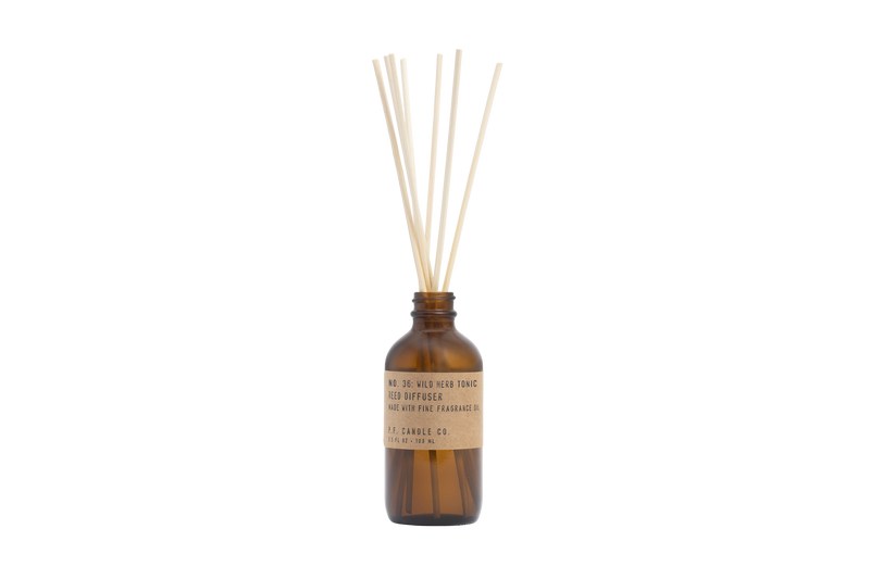 reed diffuser in amber glass number 36 by pf candle co, available at www.cuemars.com