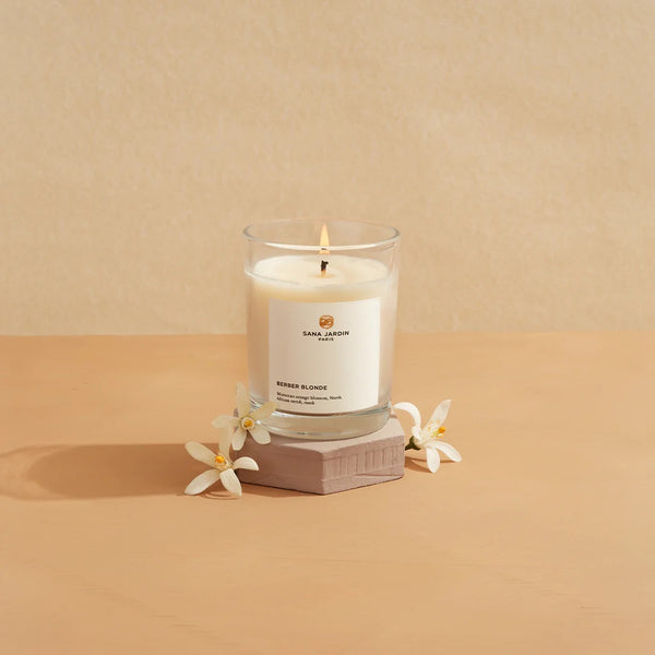 Sana Jardin scented vegan candle in a white frosted reusable glass. Available at www.cuemars.com