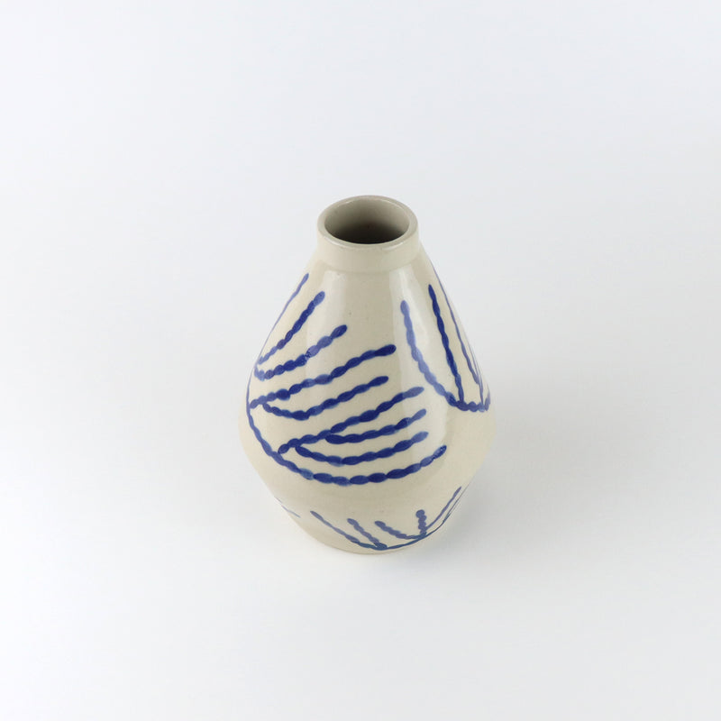Diamond shaped glazed vase with blue corals drawn by hand, made by independent ceramicist Sophie Alda. Available at www.cuemars.com