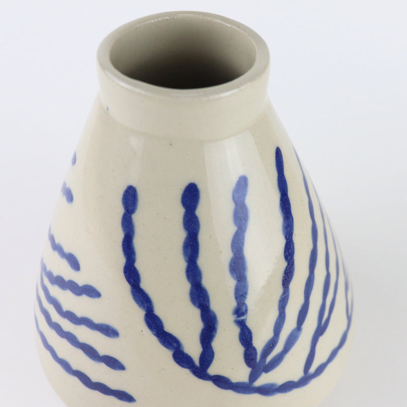 Diamond shaped glazed vase with blue corals drawn by hand, made by independent ceramicist Sophie Alda. Available at www.cuemars.com