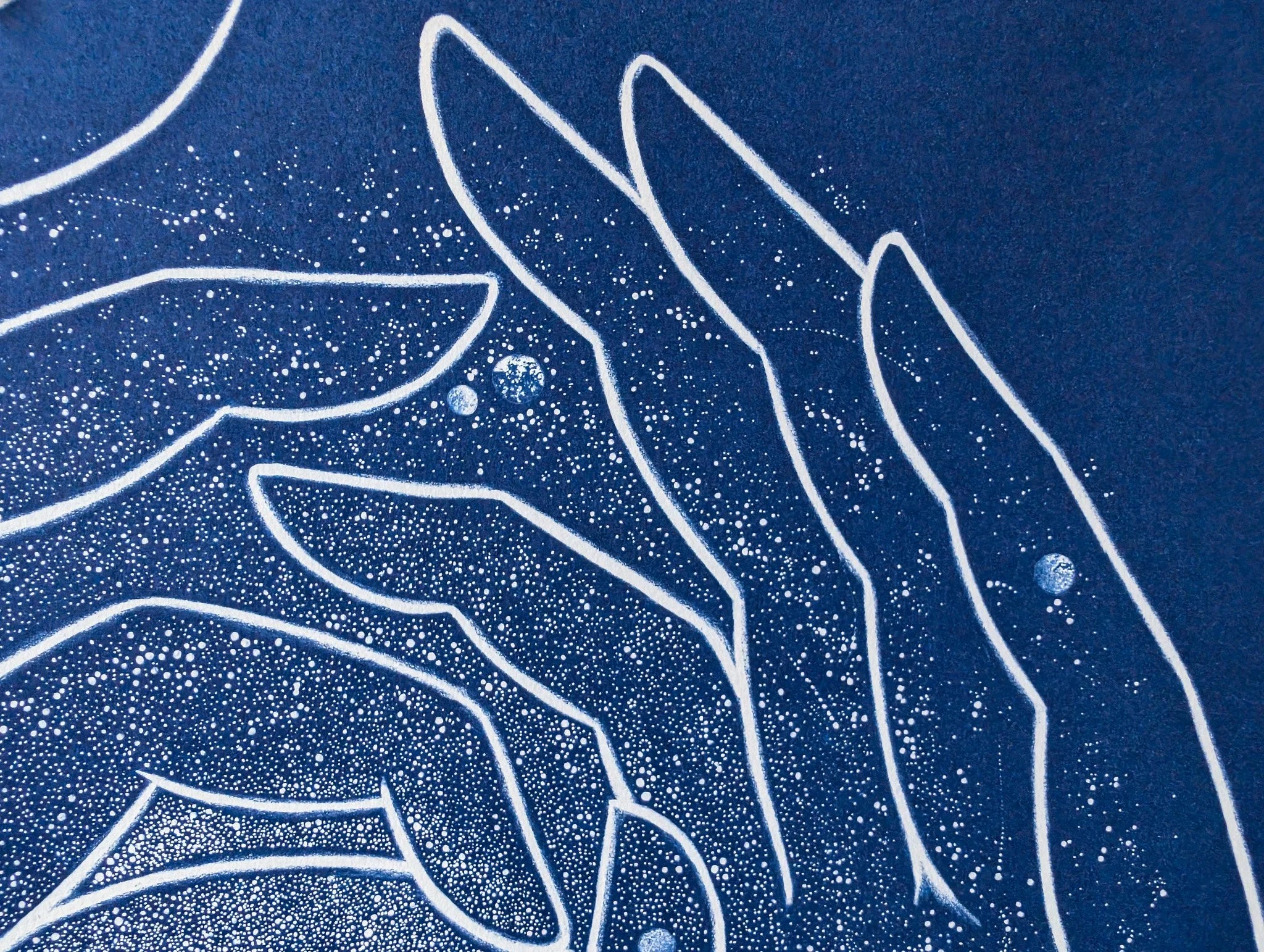 Handmade cyanotype artwork on deep blue background featuring white line drawings of multiple hands forming a circular frame around a single eye, with subtle speckled star-like patterns throughout.