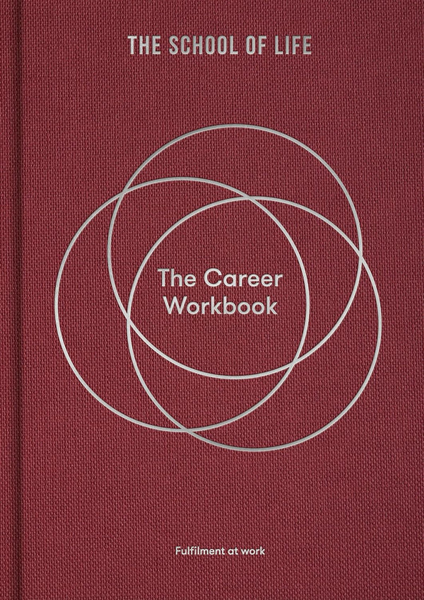 Burgundy book with white circle called The Career Workbook which is a guide to help with one's career , by The School of Life. Available at cuemars.com