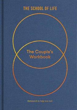 Blue book with white circle called The Couple's Workbook which is a guide to greater serenity, by The School of Life. Available at cuemars.com  Edit alt text