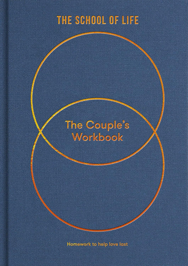 Blue book with white circle called The Couple's Workbook which is a guide to greater serenity, by The School of Life. Available at cuemars.com  Edit alt text
