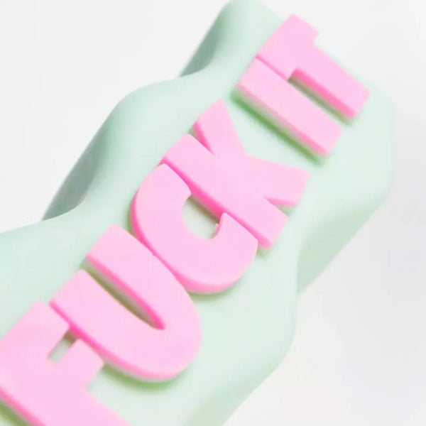 Mint green and pink Fuck It soy wax candle, by UK based independent brand Wavey Casa, available at www.cuemars.com