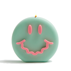 Green and pink smiley soy wax candle with a wavy smile, by UK based independent brand Wavey Casa, available at www.cuemars.com

