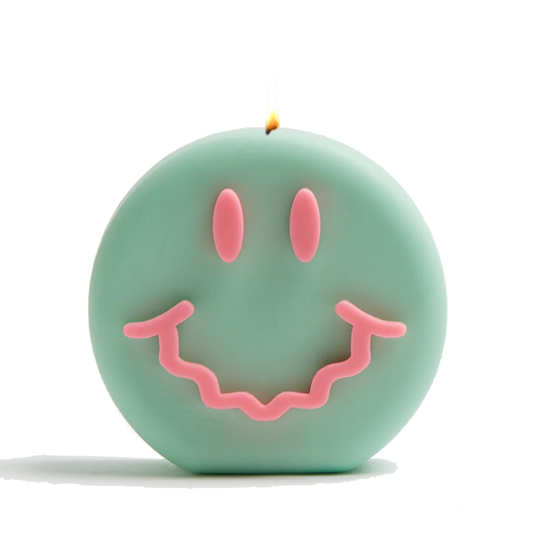 Green and pink smiley soy wax candle with a wavy smile, by UK based independent brand Wavey Casa, available at www.cuemars.com

