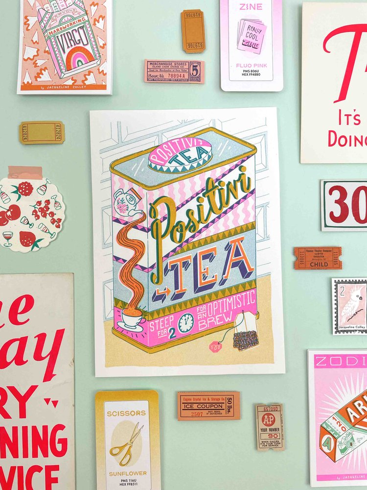 A can of tea that says Positivi-tea Optimistic Brew by Jacqueline Colley. Available at www.cuemars.com