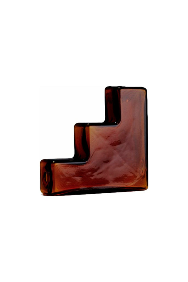 Brown decorative item and glass pipe, designed by Laundry Day. Available at www.cuemars.com