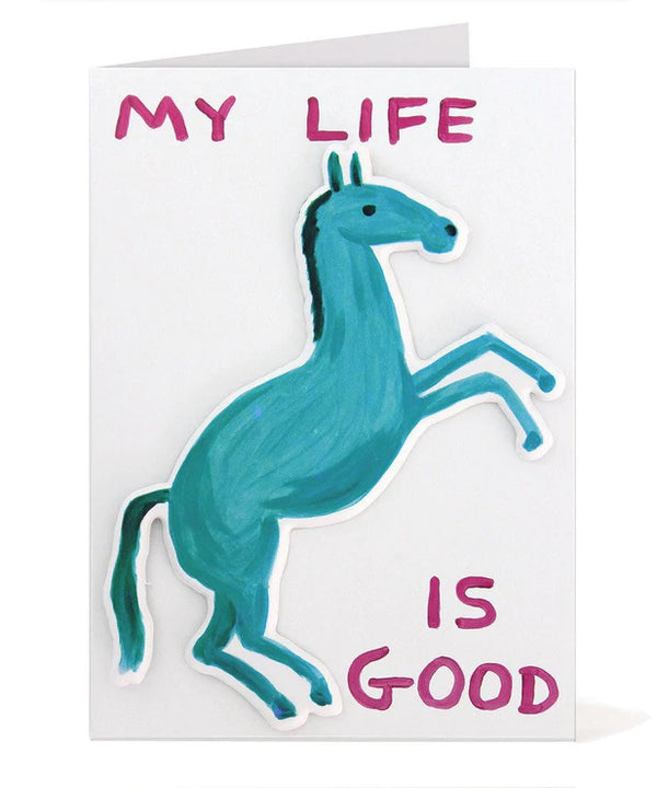sticker puffy greeting card by david shrigley illustrating a blue horse with the typography My Life Is Good, available to purchase at cuemars.com