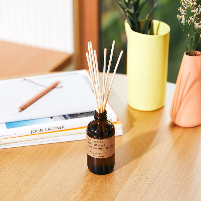 Los Angeles Reed rattan reed diffuser in an amber glass jar by PF Candle Co, available at cuemars.com